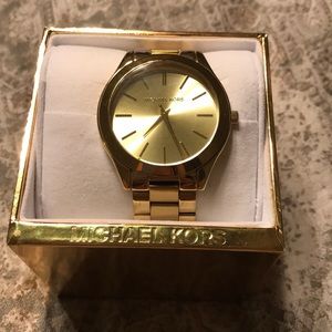 Gold Micheal Khors watch